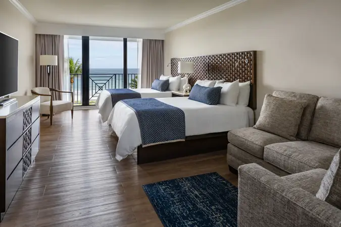 Image for room QOF - Opal Grand Oceanfront Resort & Spa Two Queen Guestroom Wide.webp